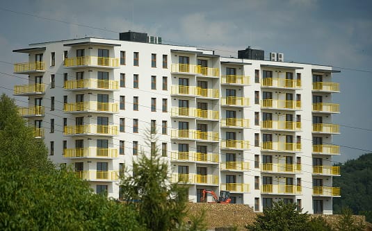 Large apartment building with multiple balconies