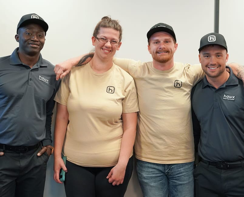 Hawx pest control team members smiling together