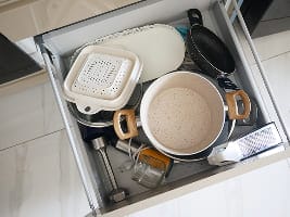 Regularly clean and declutter storage spaces like attics and garages