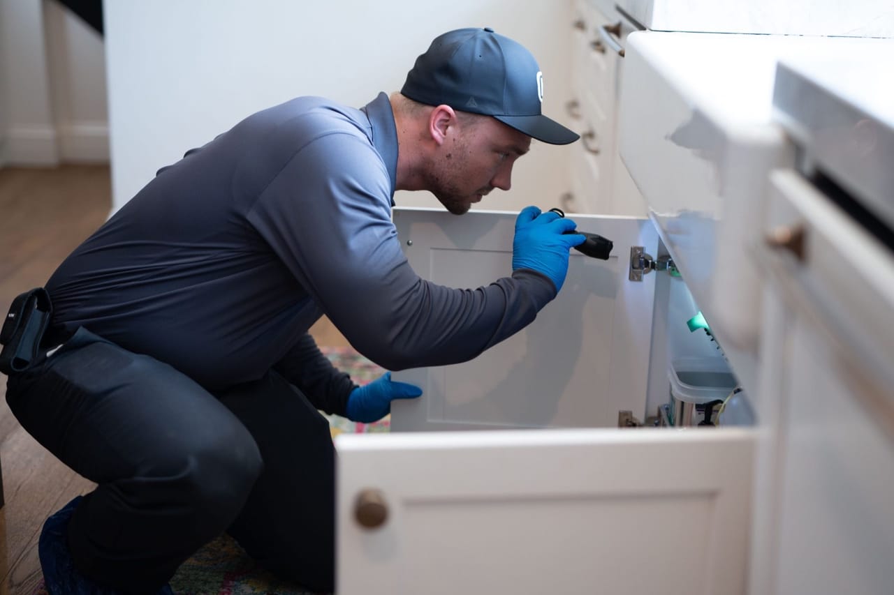 Hawx pest control technician treating for mosquitoes